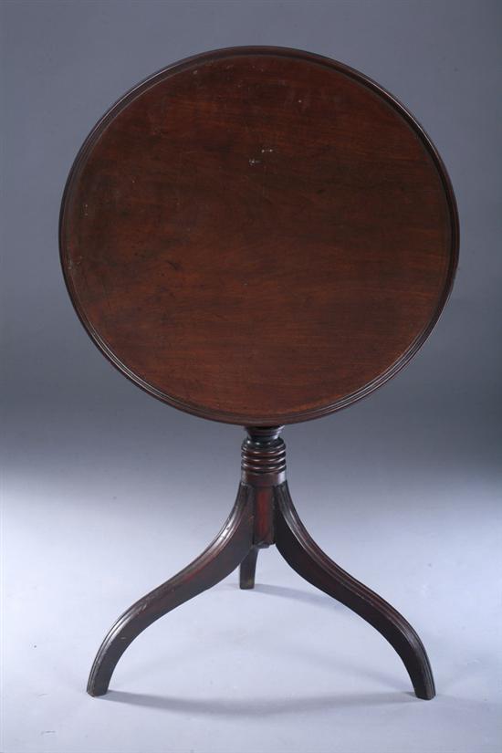 Appraisal: REGENCY WALNUT TILT-TOP TEA TABLE early th century Circular top