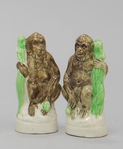 Appraisal: PAIR OF STAFFORDSHIRE FIGURES OF GORILLAS Circa Seated next to