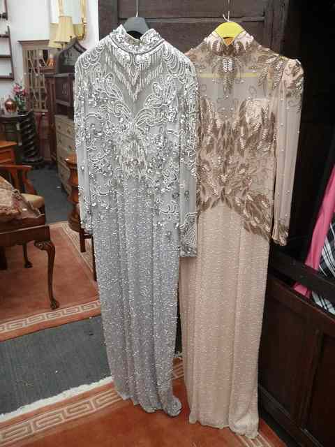 Appraisal: TWO BLACK TIE OLEG CASSINI SEQUINED AND BEADED EVENING DRESSES