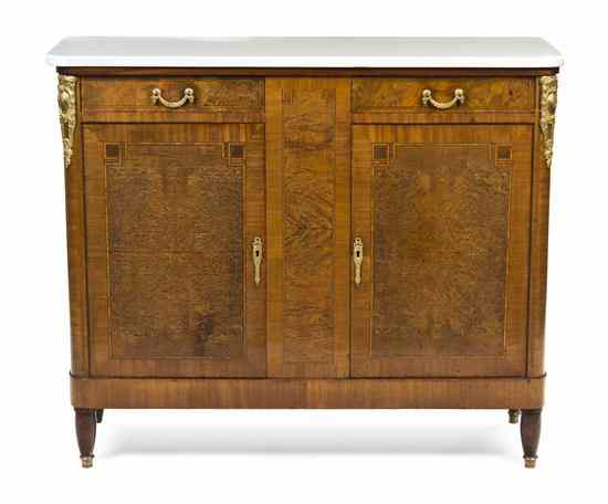 Appraisal: A Continental Burlwood and Mahogany Console Cabinet the rectangular marble