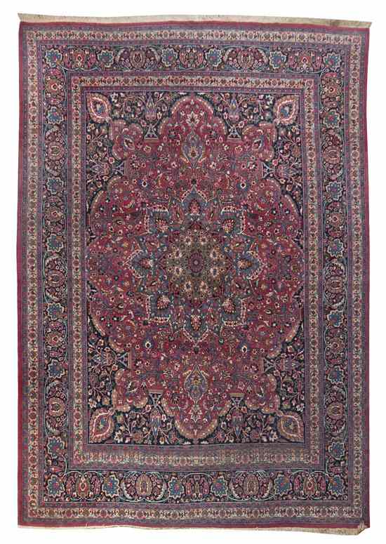 Appraisal: A Tabriz Wool Rug centered with a floral medallion on