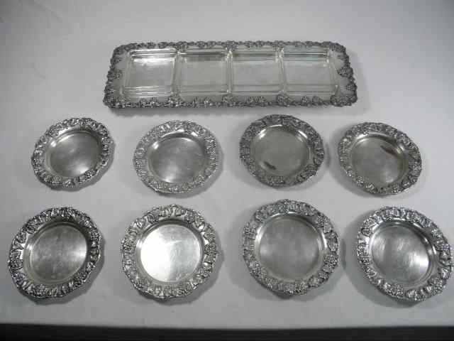 Appraisal: A silverplate sectioned server with eight '' plates The plates