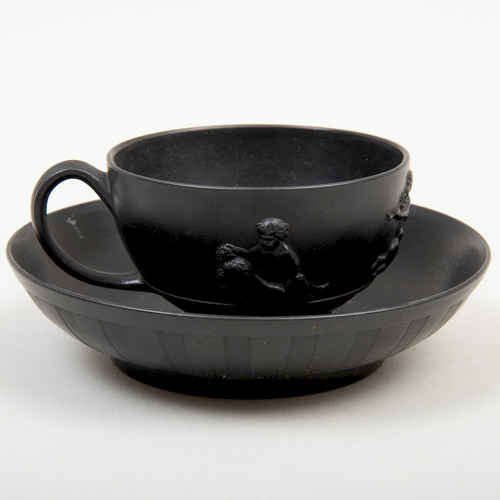 Appraisal: Wedgwood Black Basalt Cup and Saucer Impressed lowercase mark with