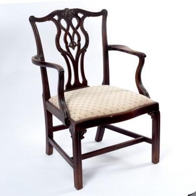 Appraisal: A George III mahogany armchair circa the foliate carved serpentine