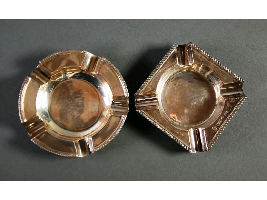 Appraisal: TWO SILVER ASHTRAYS one square with gadrooned border cm Sheffield