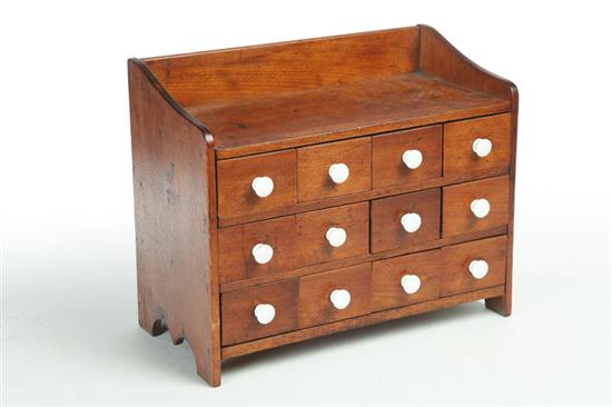 Appraisal: TABLE-TOP CHEST OF DRAWERS American th century mahogany and pine