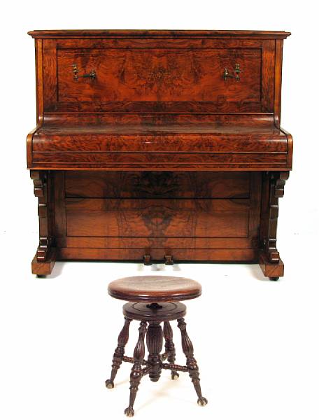 Appraisal: An English burlwood upright piano with a stool height of