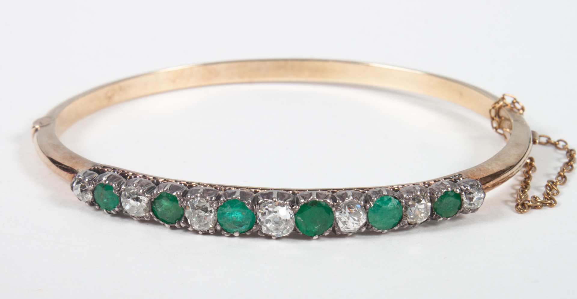 Appraisal: Victorian gold diamond emerald bangle bracelet with seven graduated round