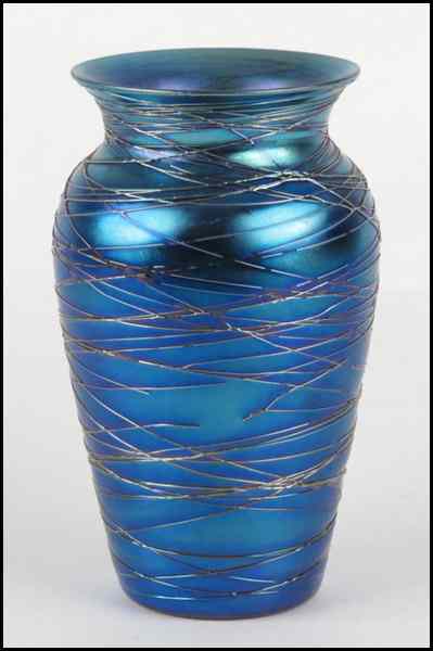 Appraisal: IRIDESCENT BLUE GLASS VASE Bearing threaded glass detail throughout Unsigned