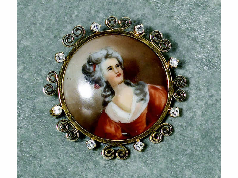 Appraisal: PORTRAIT BROOCH Yellow gold with painting on porcelain set with