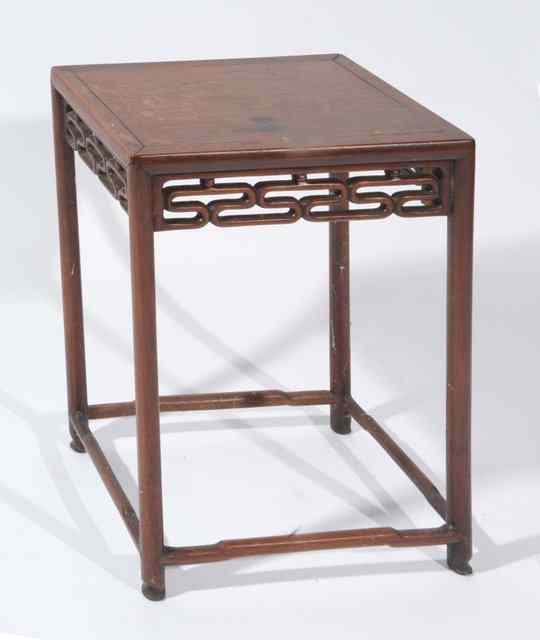 Appraisal: A CHINESE HARDWOOD OCCASIONAL TABLE with retangular top and carved