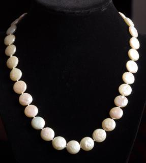 Appraisal: Coin Pearl Necklace mm round coin pearls with knots in