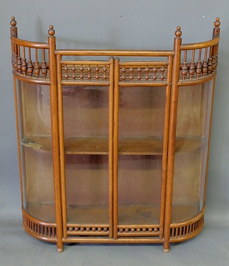 Appraisal: Oak ball stick hanging cupboard c with curved glass sides