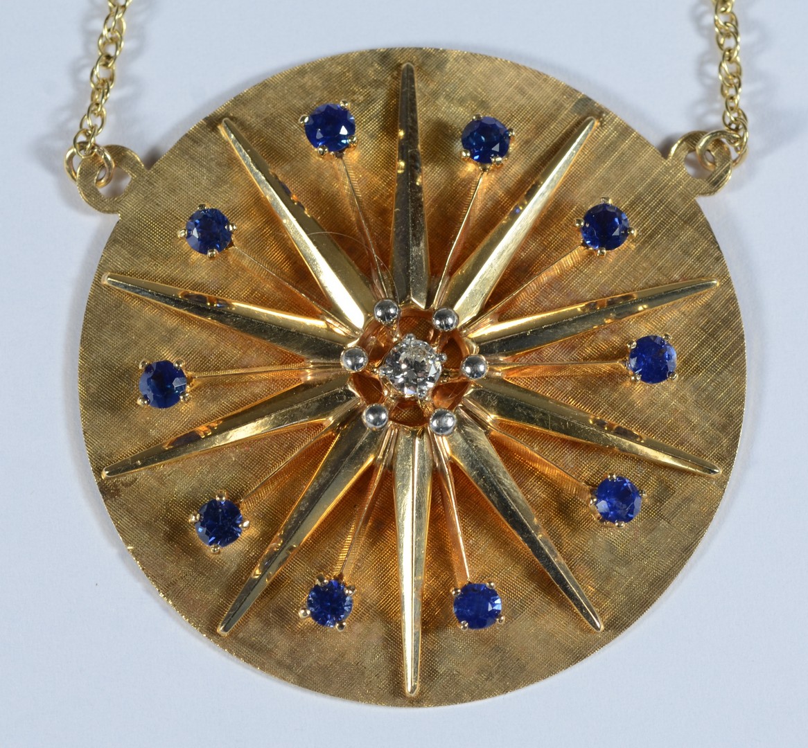 Appraisal: K YG sunburst pendant w a center diamond about mm