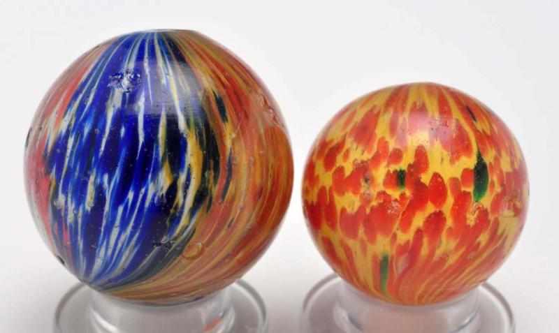 Appraisal: Lot of Onionskin Marbles Description The smaller marble is a