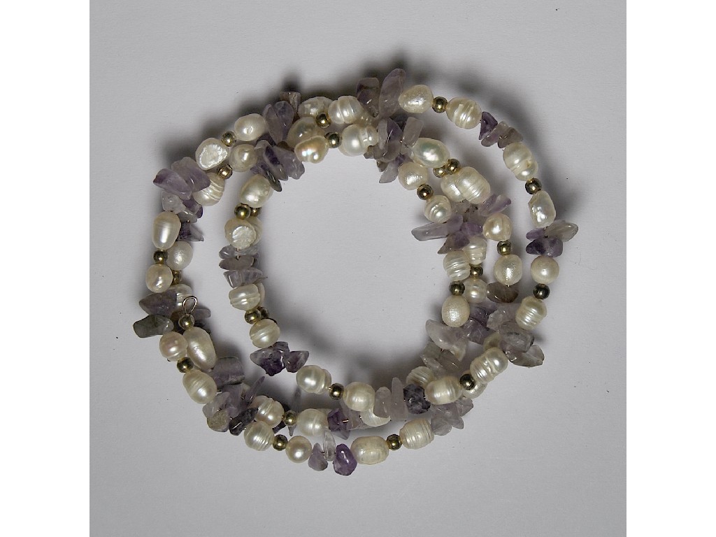 Appraisal: Coiled four row bracelet of tumbled amethyst and cultured pearl