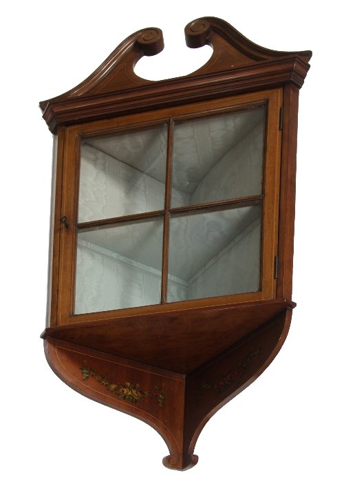 Appraisal: An Edwardian glass fronted hanging corner cupboard cm wide