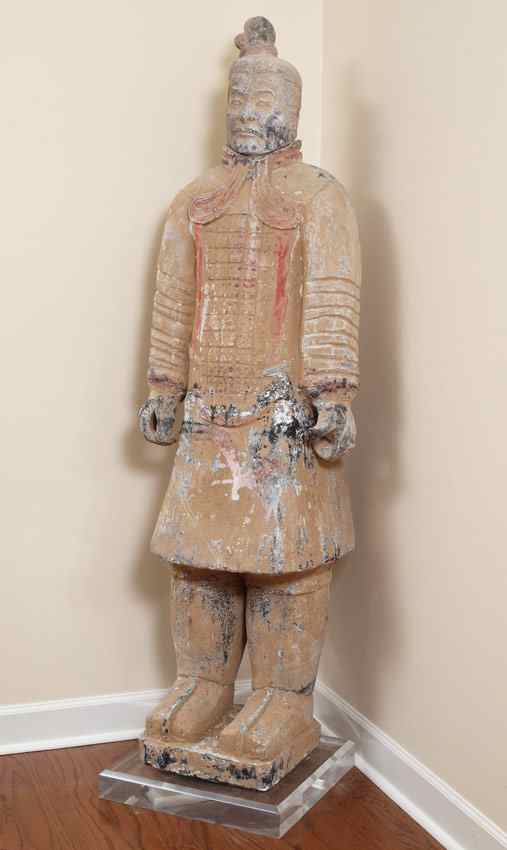 Appraisal: LIFE SIZE TERRACOTTA TEMPLE GUARD A life size figure of