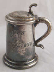 Appraisal: A Dunhill silver plated tankard cigarette lighter