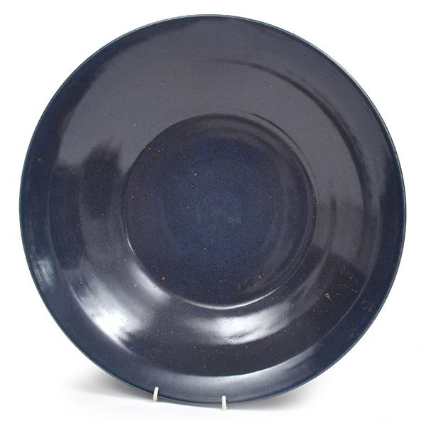 Appraisal: A CHINESE BLUE GLAZED EARTHENWARE CHARGER shallow circular cm diameter