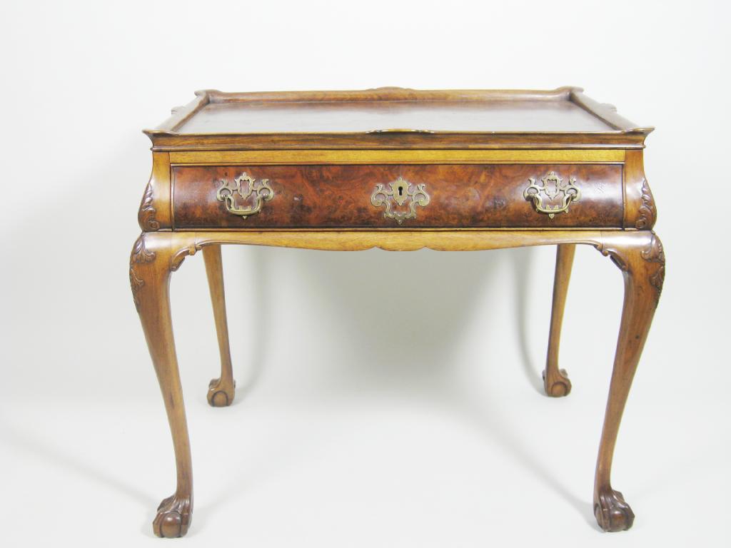 Appraisal: A walnut and burr walnut silver Table with raised gallery