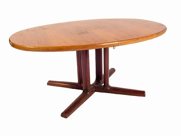 Appraisal: A Danish oval rosewood veneer dining table together with six