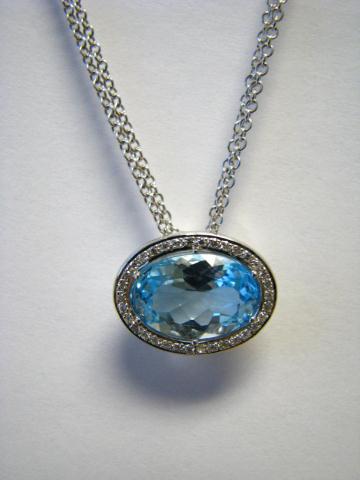 Appraisal: K white gold blue topaz and diamond pendant on double