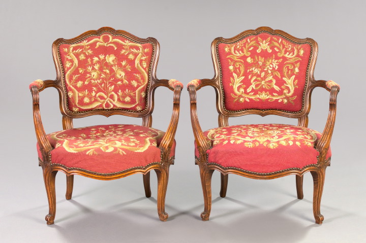 Appraisal: Pair of Provincial Louis XV-Style Beechwood Fauteuils each with a