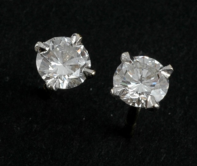 Appraisal: A pair of diamond stud earrings Each claw set with