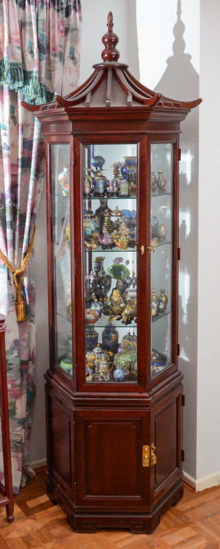 Appraisal: A TALL HEXAGONAL PAGODA DESIGN CURIO CABINET Illuminated cabinet with