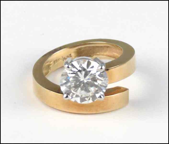 Appraisal: DIAMOND AND KARAT YELLOW GOLD RING Round brilliant diamond is