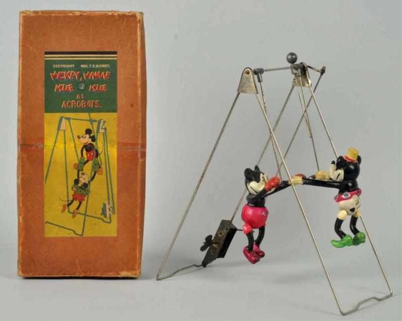 Appraisal: Celluloid Disney Mickey Minnie Acrobat Toy Figures are celluloid with