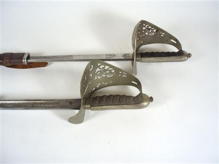 Appraisal: Two early th century standard issue infantry Officer swords pattern