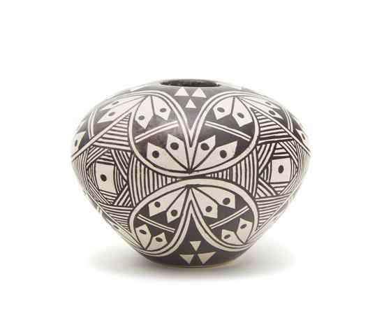 Appraisal: A Hopi Cream Slip Miniature Seed Bowl with fineline decoration