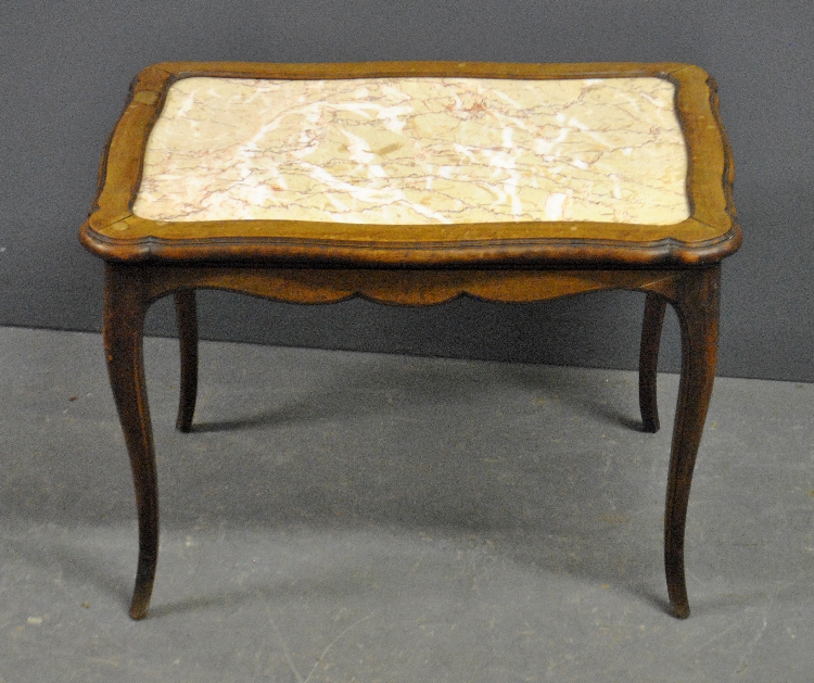 Appraisal: - Small French Provincial style walnut coffee table with marble