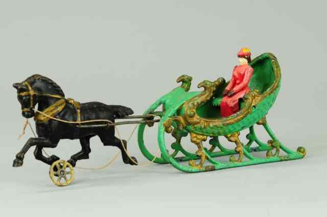 Appraisal: ONE HORSE OPEN SLEIGH Hubley green and gold sleigh pulled