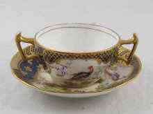 Appraisal: Tiffany A two handled cup and saucer hand decorated with