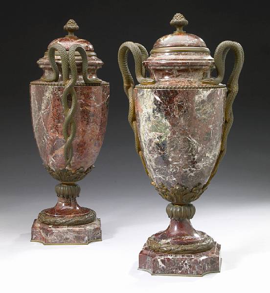 Appraisal: A pair of Louis XVI style bronze mounted marble urns