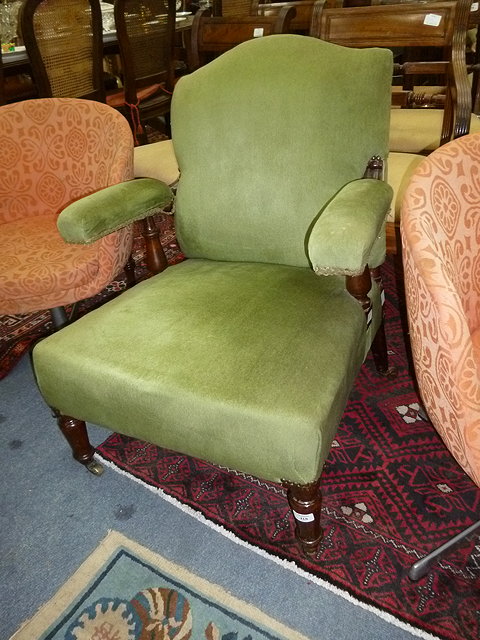 Appraisal: A VICTORIAN GREEN DRAYLON UPHOLSTERED ELBOW CHAIR with turned front