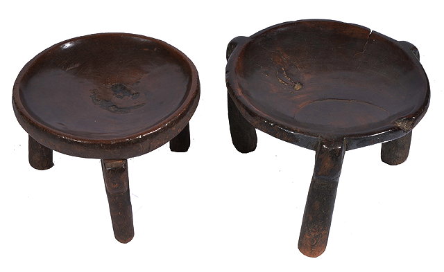 Appraisal: A LOW AFRICAN HARDWOOD DISHED TOPPED STOOL standing on three