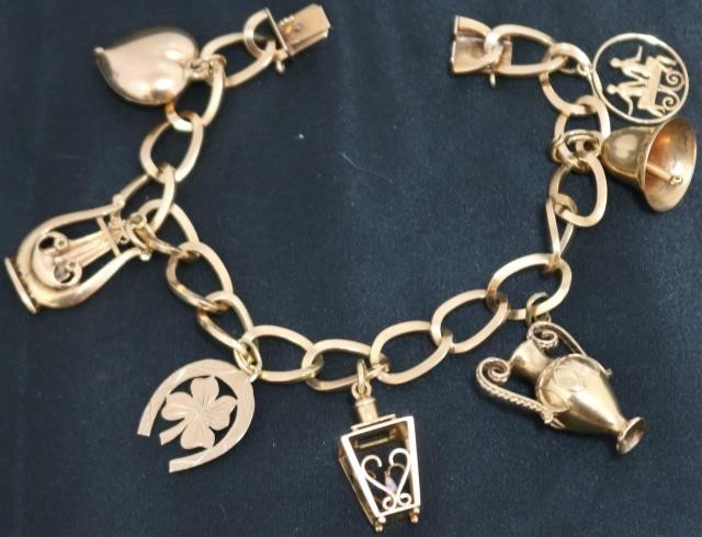 Appraisal: KT YELLOW GOLD CHARM BRACELET WITH CHARMS CHARMS AND KT