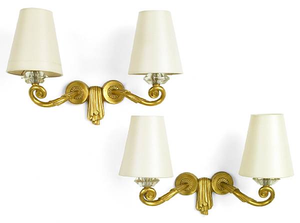 Appraisal: A pair of Jules Leleu gilt-bronze two-light sconces s one