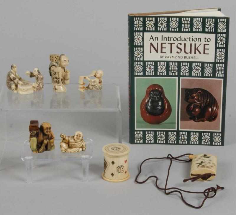 Appraisal: Lot of Netsuke Figures Book Description Includes one man holding