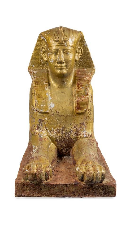 Appraisal: A Gold-Painted Cast Iron Model of a Sphinx Height x