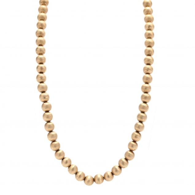 Appraisal: GOLD BEAD NECKLACE Necklace comprised of round brushed gold beads