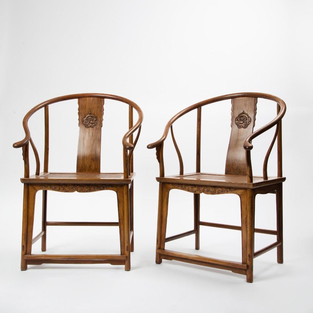 Appraisal: A PAIR OF TH CENTURY CHINESE HUANGHUALI CHAIRS Elegant large