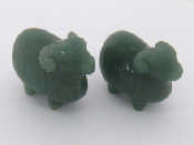 Appraisal: A pair of green Chinese hardstone rams each cm long