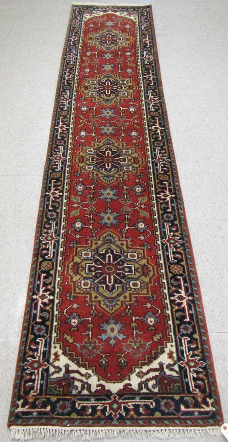 Appraisal: HAND KNOTTED ORIENTAL RUNNER Persian Serapi design featuring four geometric