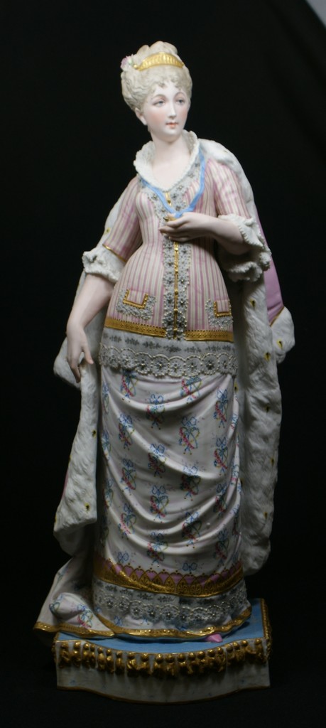 Appraisal: Bisque figurine of a woman in an elegant gown and