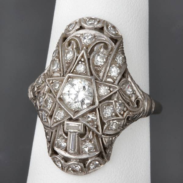 Appraisal: A diamond and k white gold filigree ring